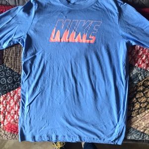 The Nike tee boys light blue with neon orange just do it on the arms